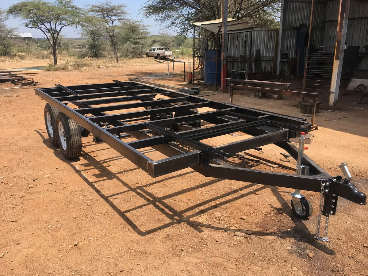 Twin-axle flatbed trailer chassis fabricated in the workshop yard