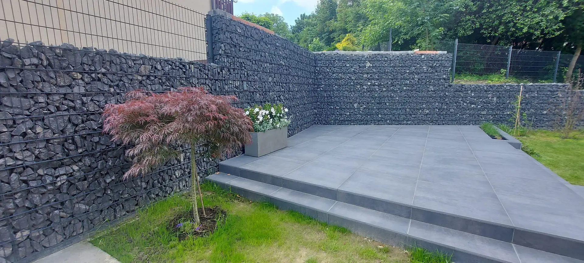 Gabion retaining walls around a modern patio